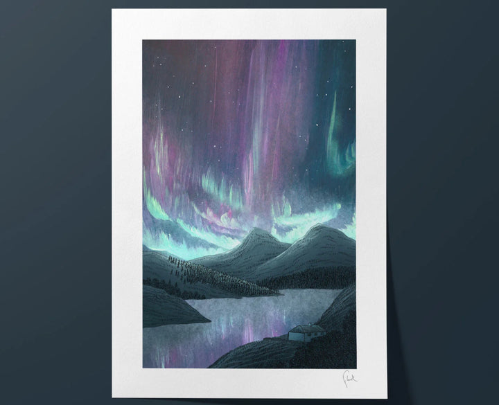 Framed artwork of a mountain landscape with colorful aurora lights against a dark blue sky.