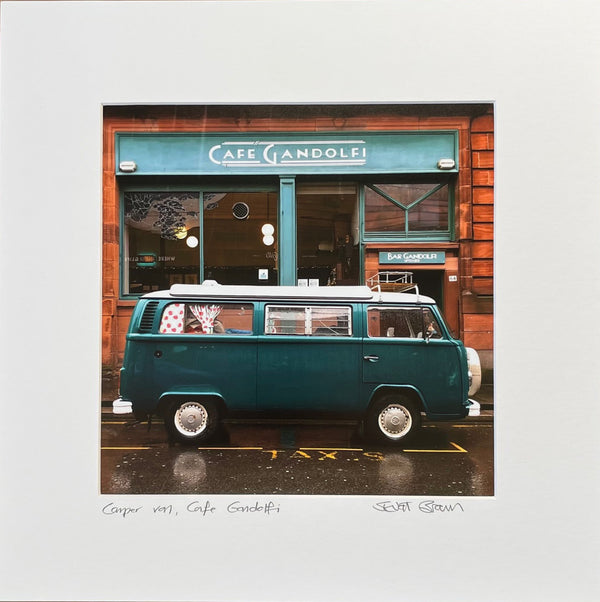 a green vw van parked outside the cafe gandolfi in glasgow