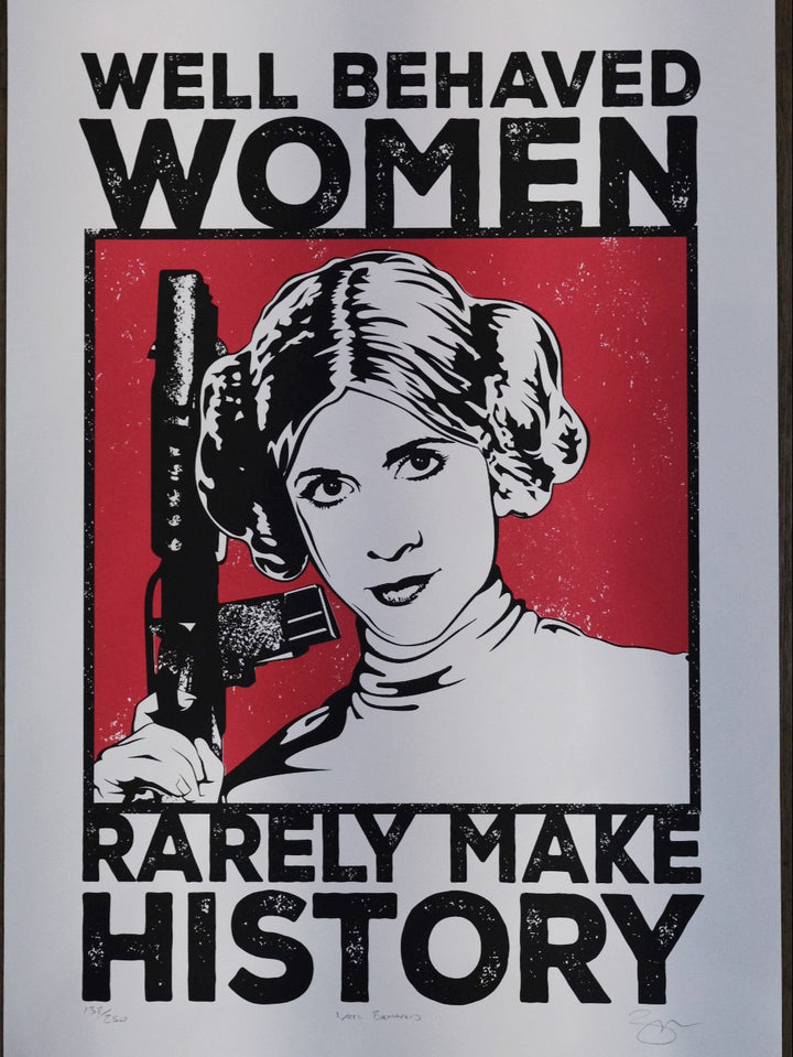 A poster featuring the phrase 'Well Behaved Women Rarely Make History' with an image of Princess Leia from Star Wars. The poster has a predominantly red background with white and black text, and a silhouette of Princess Leia holding a gun.