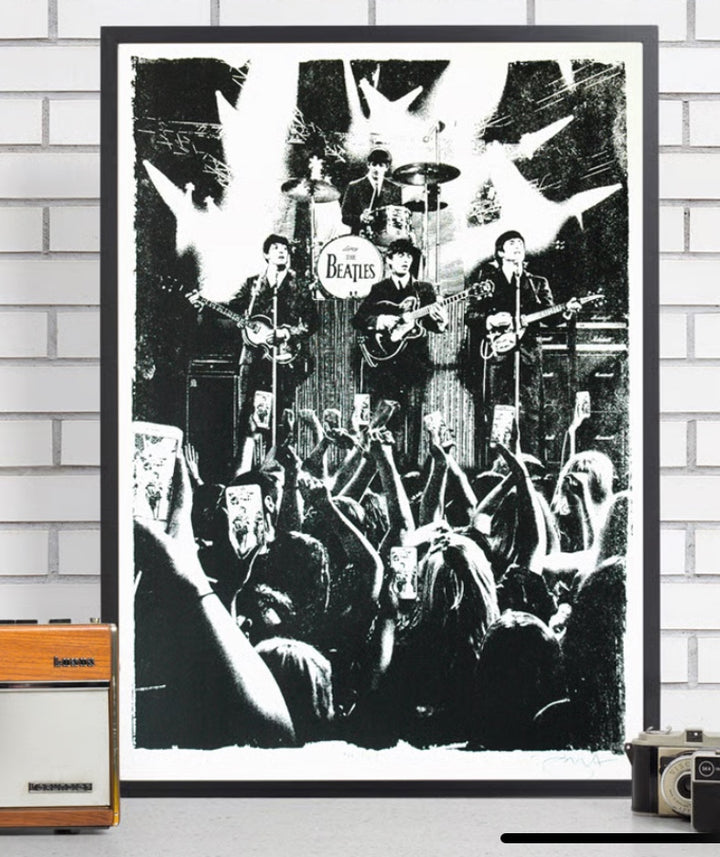 black and white screen print of The Beatles performing on stage with a crowd watching through their phones.