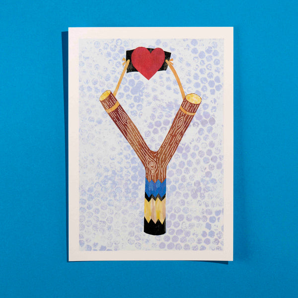 A print of a catapult with a love heart with textured background