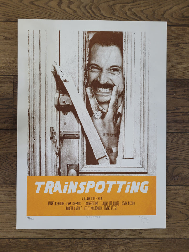 Trainspotting poster with Begbie doing his Jack Nicholson impresson breaking through a door. text says trainspotting 
