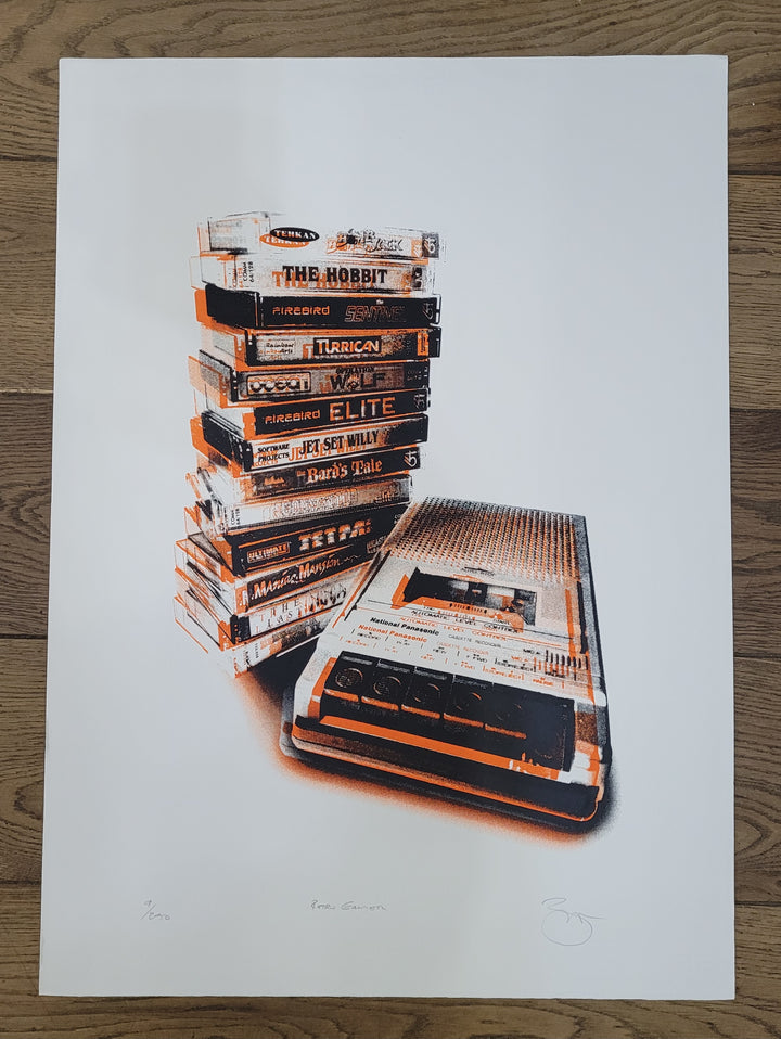 Stack of vintage video game cases on a white background